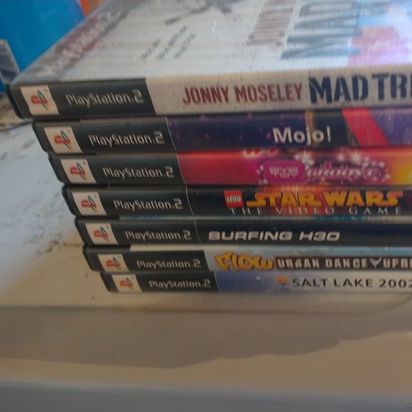 NWOT PS 2 games bundleof 7 professionally refurbished disks with instuctions!